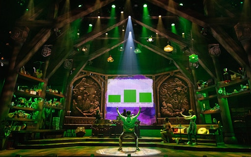Stage set of Dungeons & Dragons: The Twenty-Sided Tavern with actors and fantasy decor.
