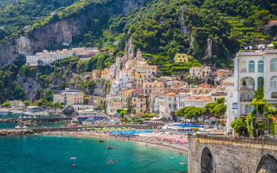 Scenic view of Amalfi town with colorful buildings and beach on the Amalfi Coast.