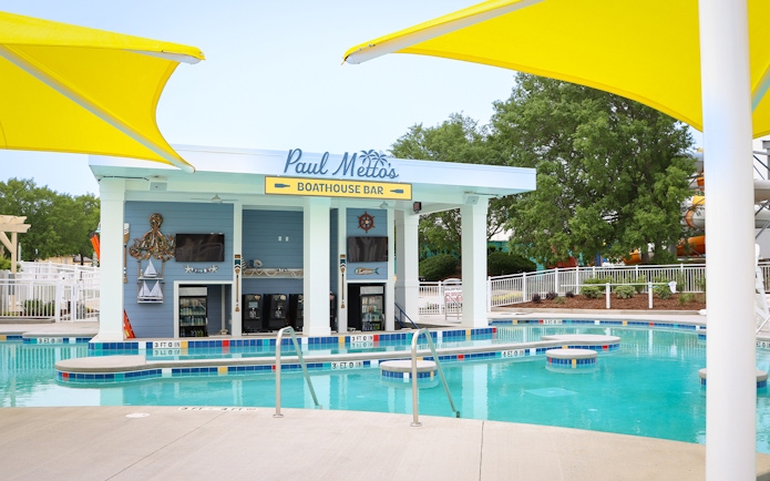 Boathouse Bar at Carolina Harbor water park, Six Flags Carowinds, with pool and seating.