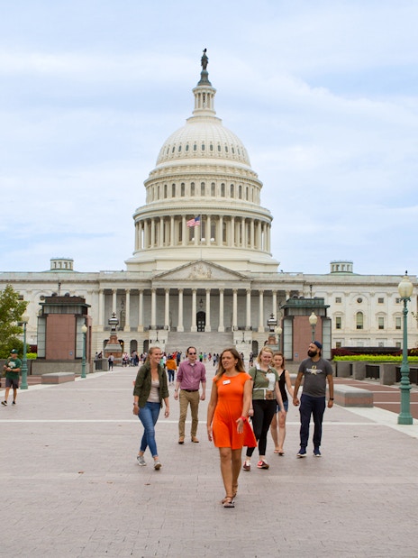 Tour guide leading tourists near the Capitol Building in Washington D.C.