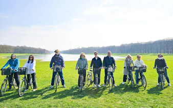 Group biking in Versailles gardens near the Grand Canal.