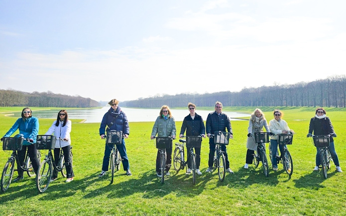 Group biking in Versailles gardens near the Grand Canal.