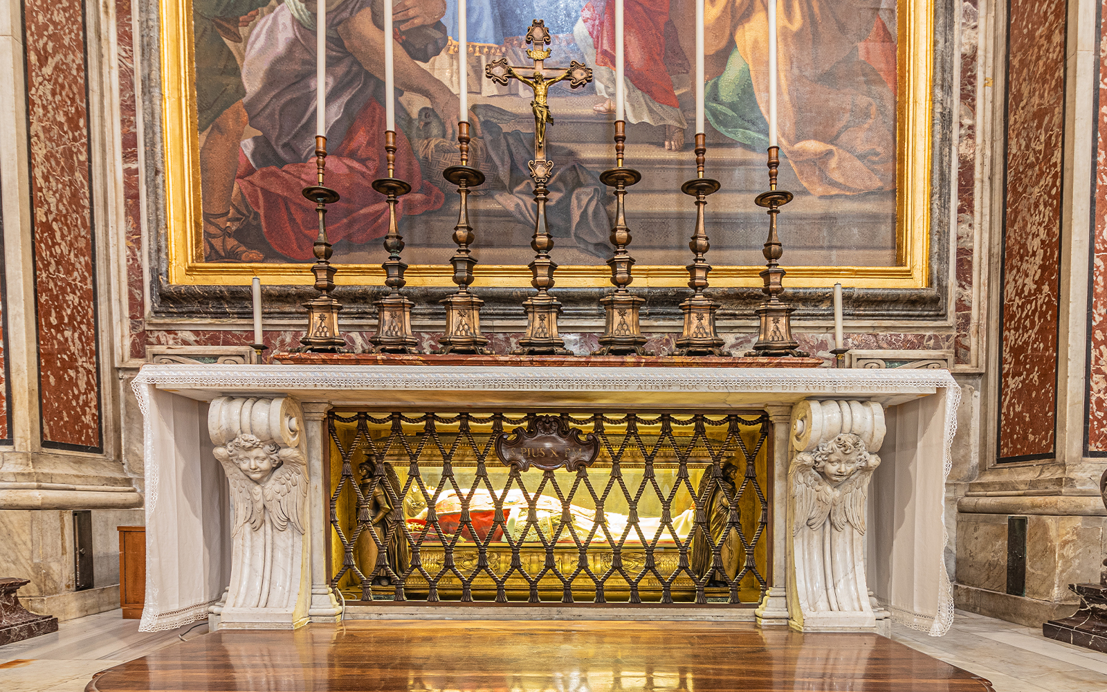 St Peter's Grotto in Vatican City with intricate stone carvings and religious artifacts.