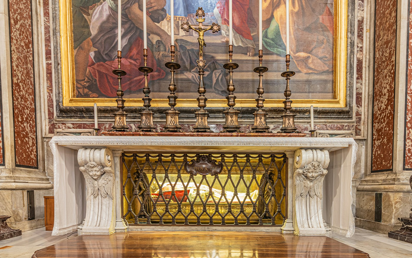 St Peter's Grotto in Vatican City with intricate stone carvings and religious artifacts.