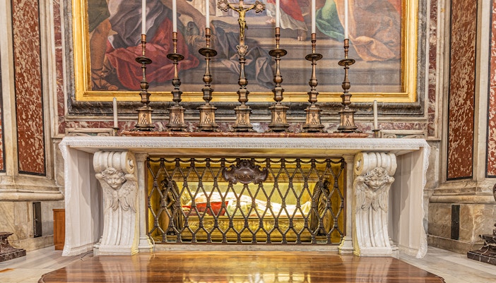 St Peter's Grotto in Vatican City with intricate stone carvings and religious artifacts.