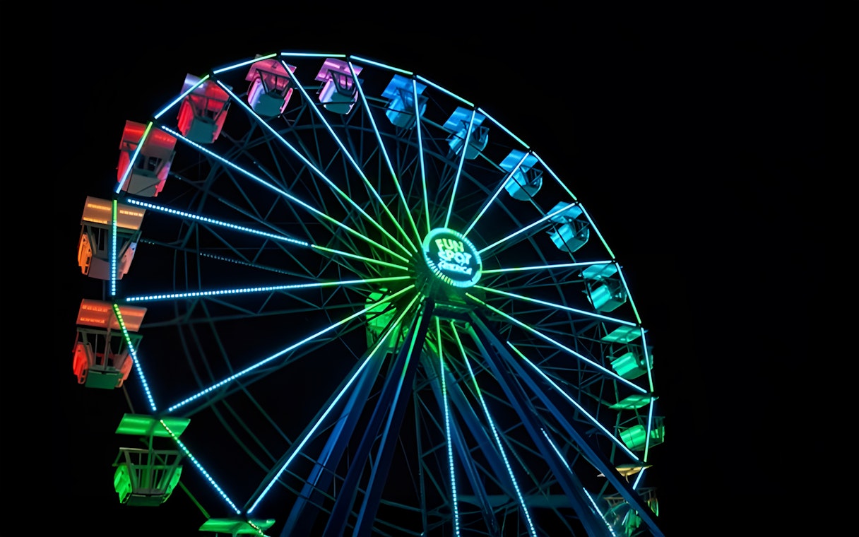 Ferris wheel illuminated at night, Fun Spot America Theme Parks, Orlando.