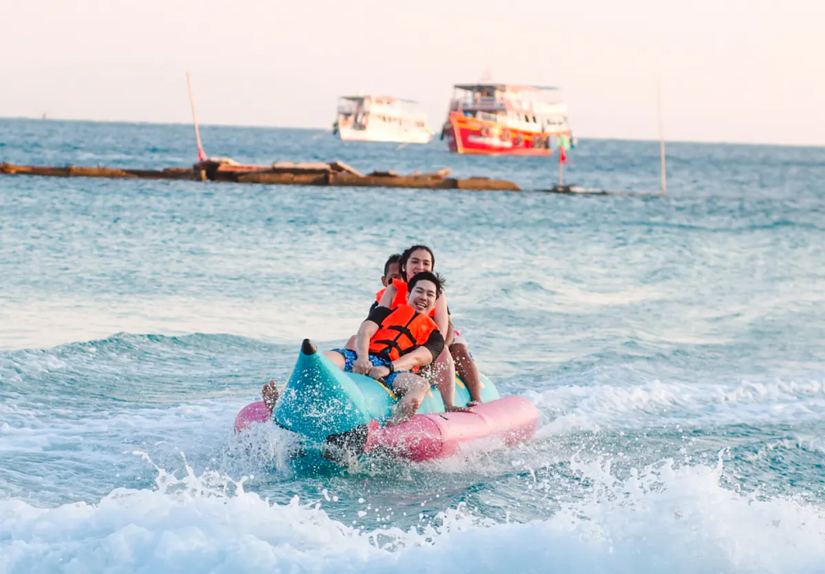 People enjoying a banana boat ride on the Pattaya to Coral Island tour.
