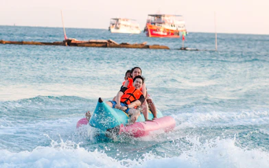 People enjoying a banana boat ride on the Pattaya to Coral Island tour.