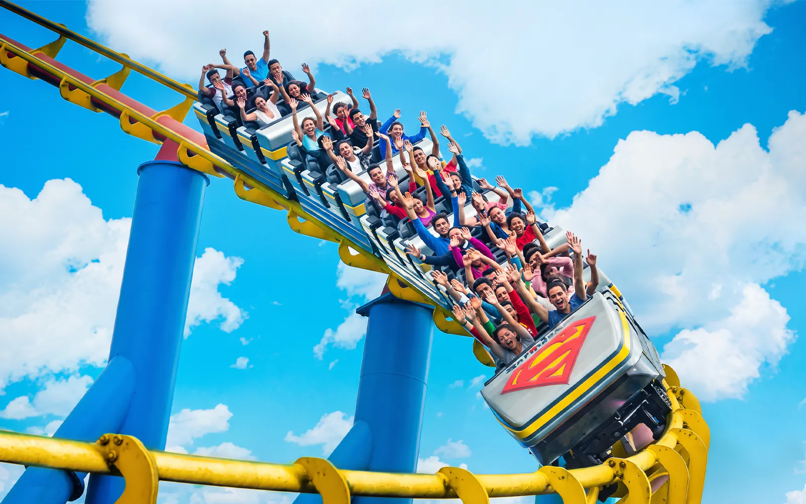 Six Flags Mexico Superman rollercoaster with excited riders on a loop.