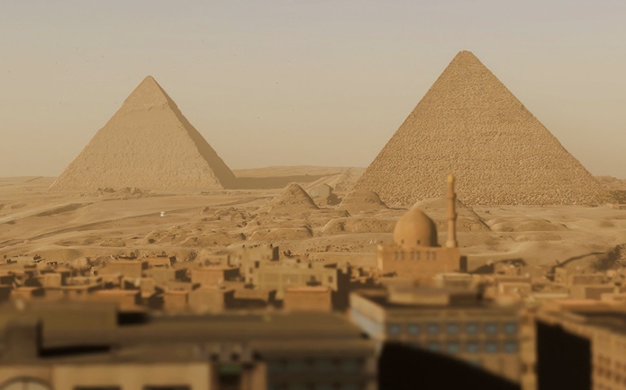 Great Pyramids of Giza with surrounding desert landscape in a virtual reality experience.