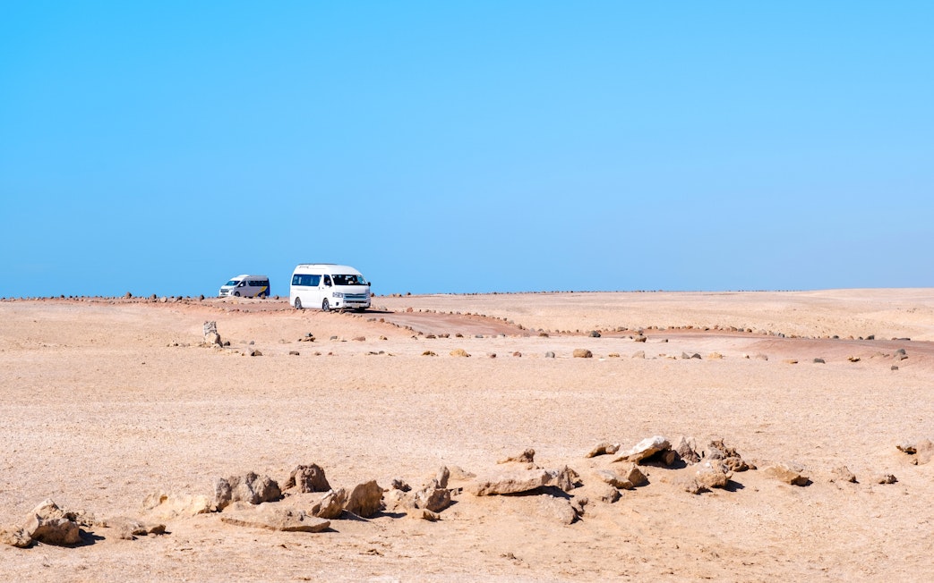 Tour buses driving through the desert in Ras Mohammed National Park.