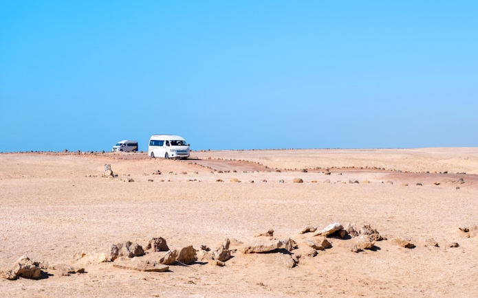 Tour buses driving through the desert in Ras Mohammed National Park.