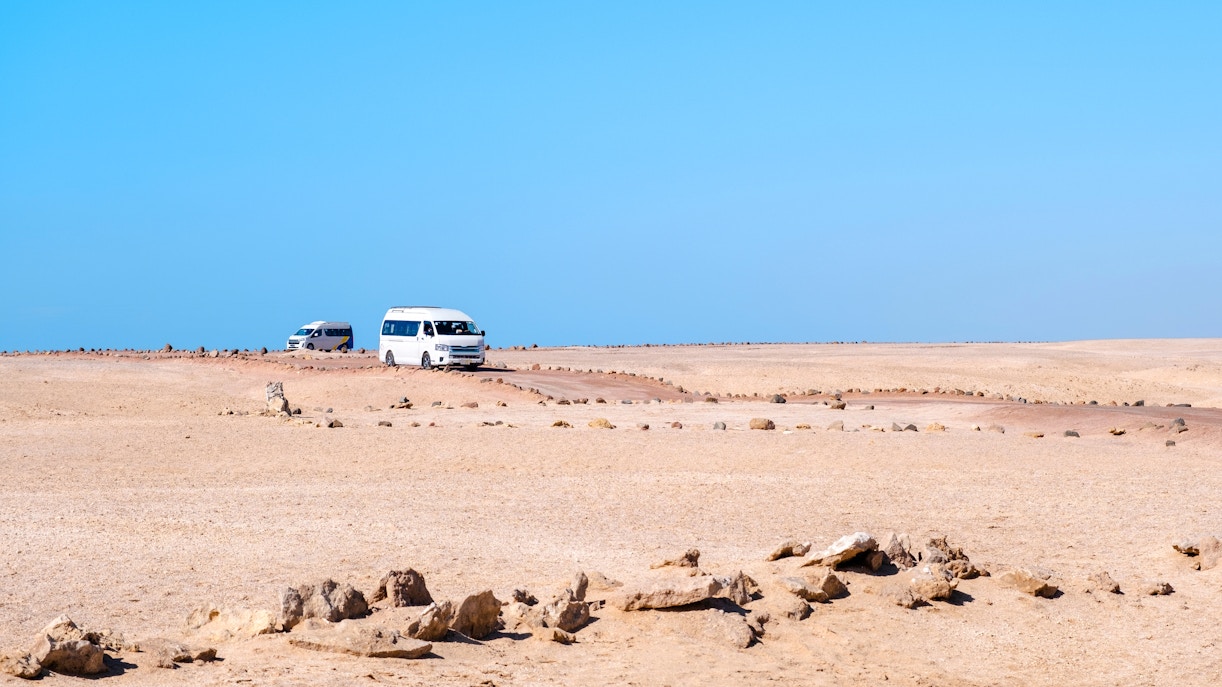 Tour buses driving through the desert in Ras Mohammed National Park.