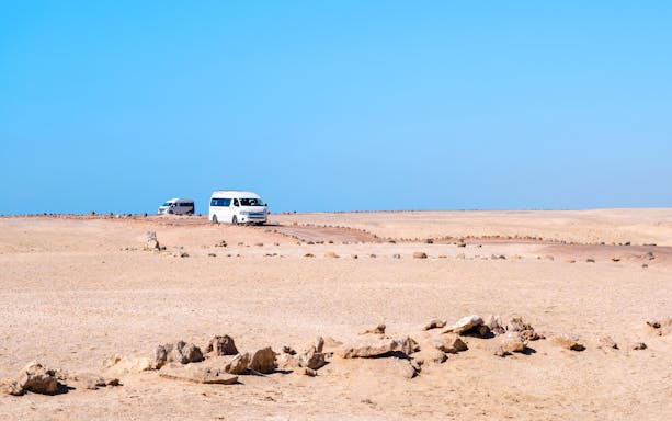 Tour buses driving through the desert in Ras Mohammed National Park.