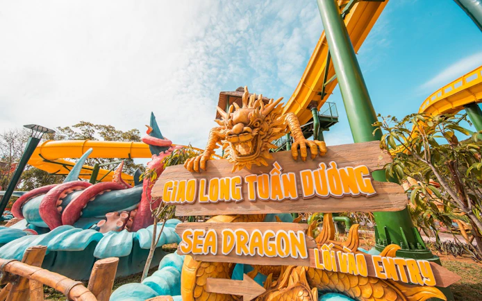 Sea Dragon water ride entrance at Aquatopia with dragon sculpture and colorful slides.