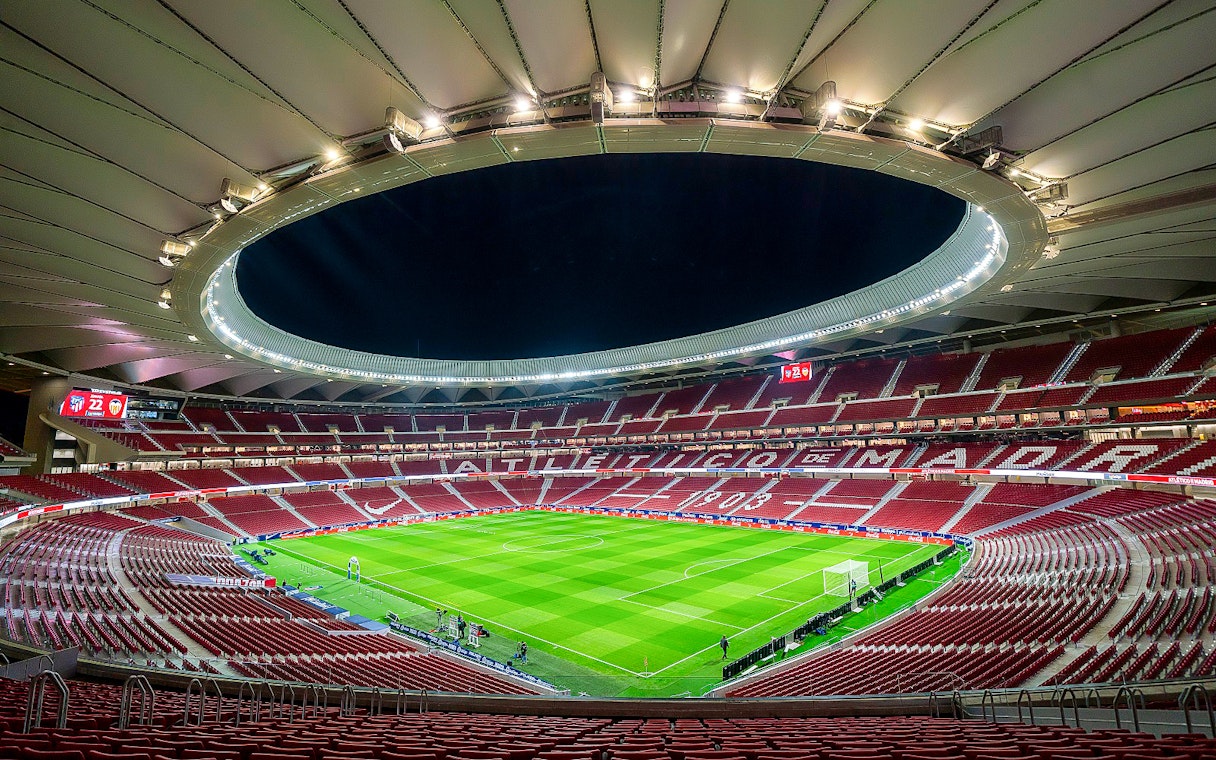 Cívitas Metropolitano stadium interior during a guided tour, showcasing the field and seating.