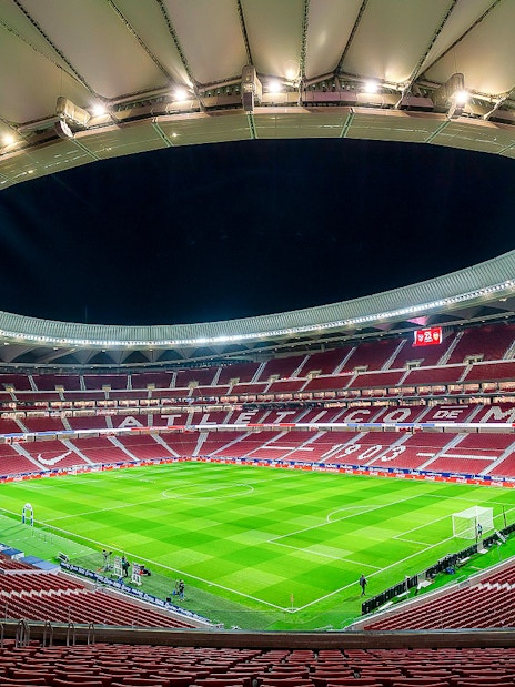 Cívitas Metropolitano stadium interior during a guided tour, showcasing the field and seating.
