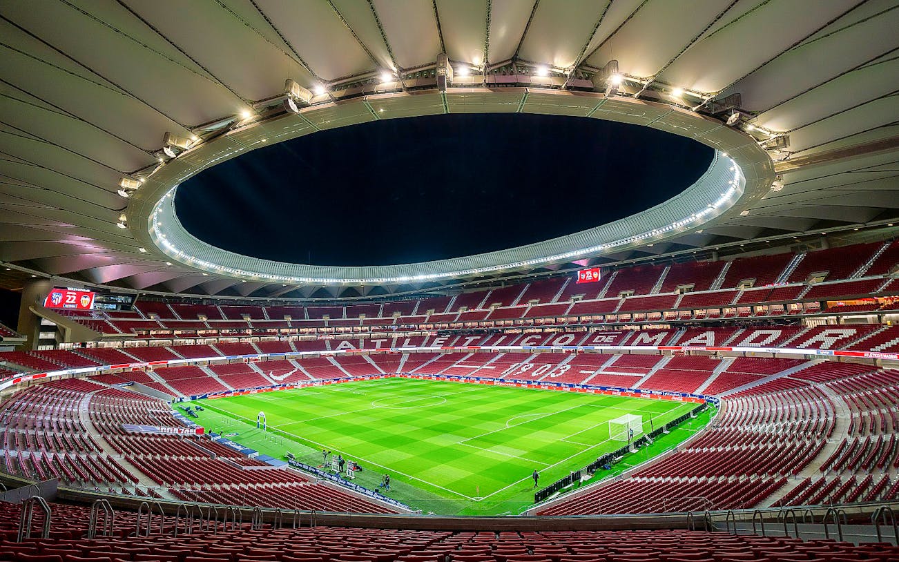 Cívitas Metropolitano stadium interior during a guided tour, showcasing the field and seating.