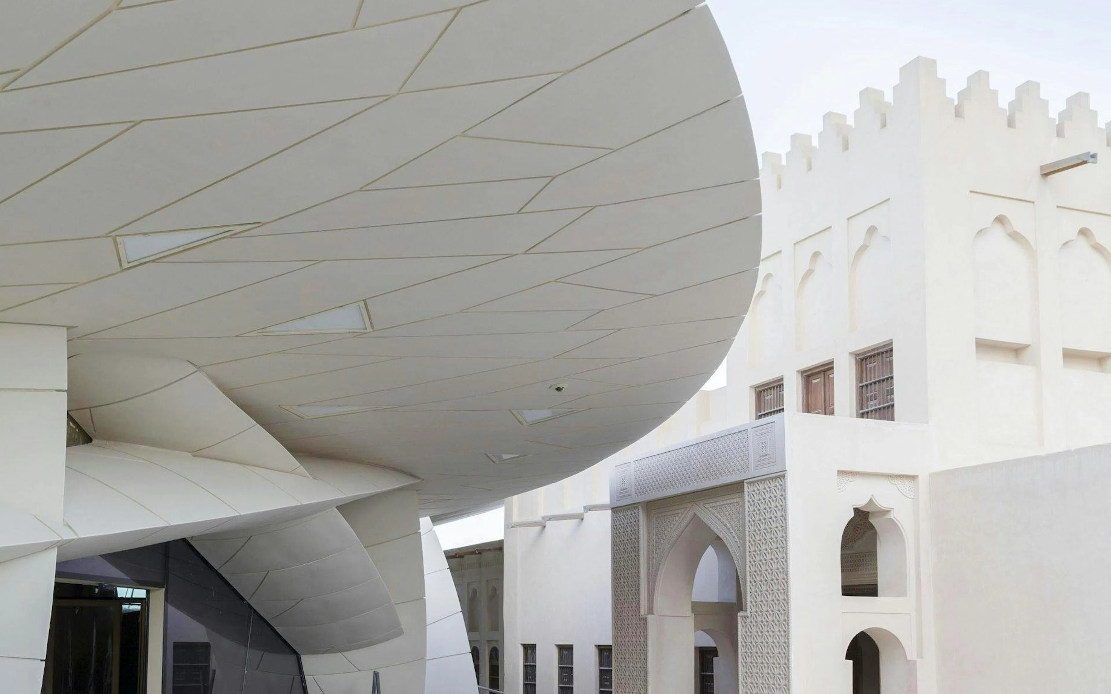 National Museum of Qatar's modern architecture with traditional design elements.