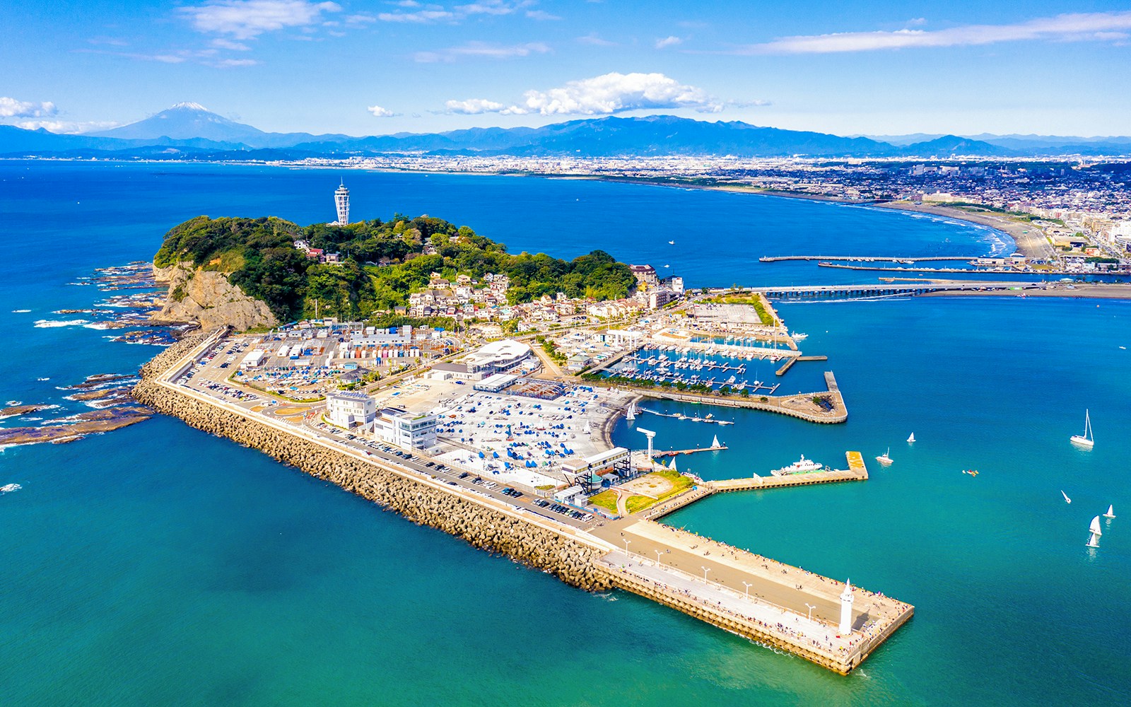 Aerial view of Enoshima Island, Japan, showcasing coastal landscape and surrounding waters.