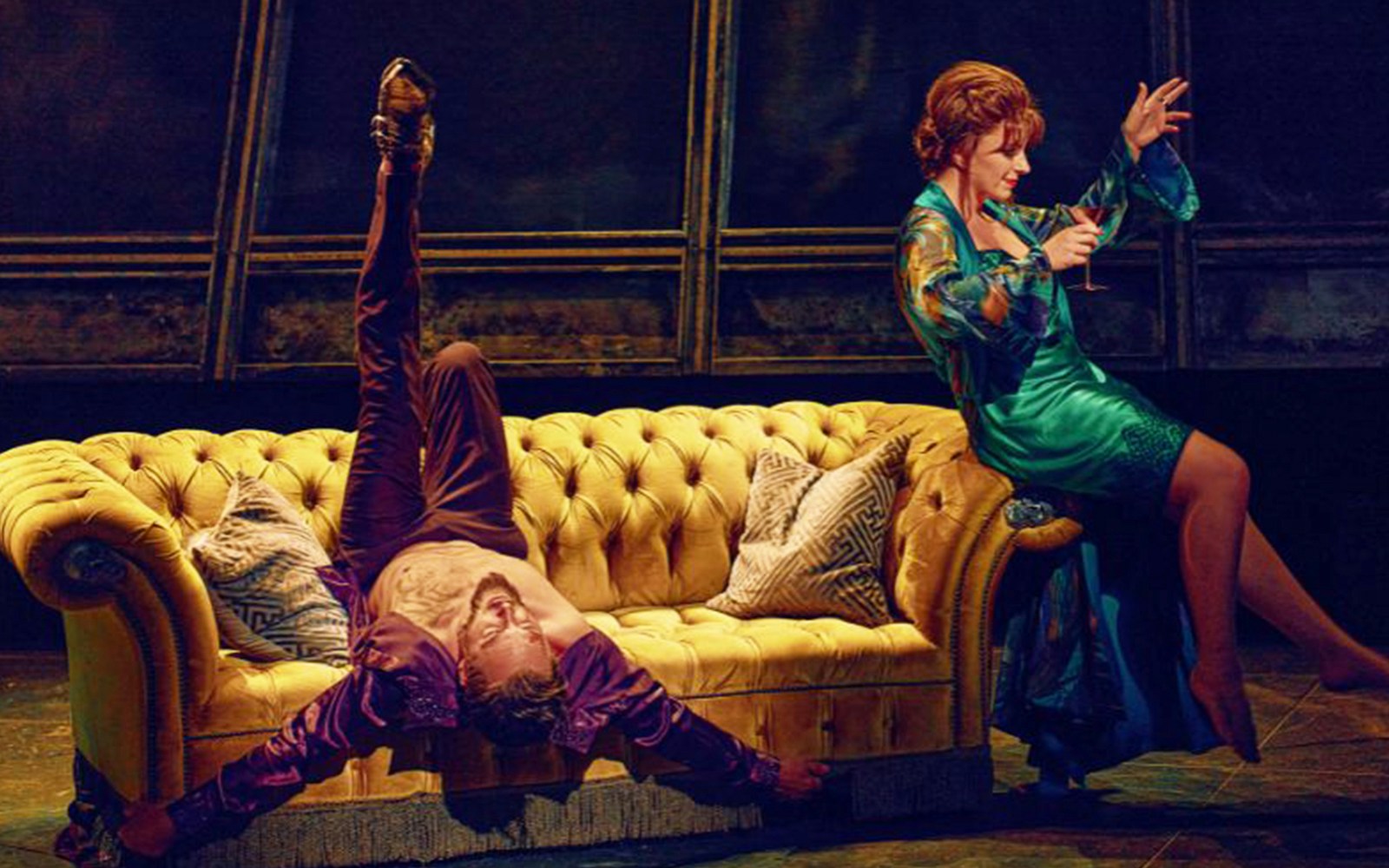 Performer on a yellow couch during Bat Out Of Hell Singalong show.