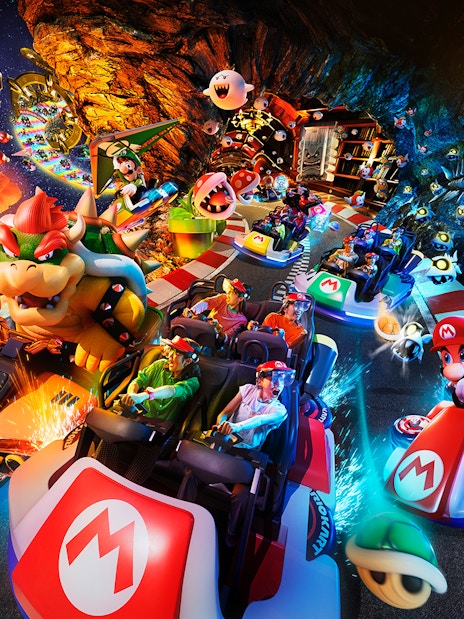 Mario Kart ride with characters at Universal Studios Japan, featuring Bowser and Mario racing.