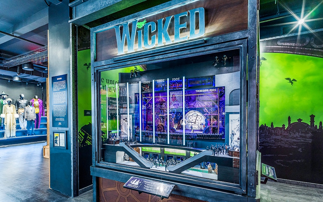 Wicked exhibit at the Museum of Broadway featuring costumes and stage model.