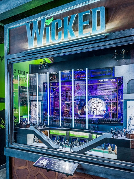 Wicked exhibit at the Museum of Broadway featuring costumes and stage model.