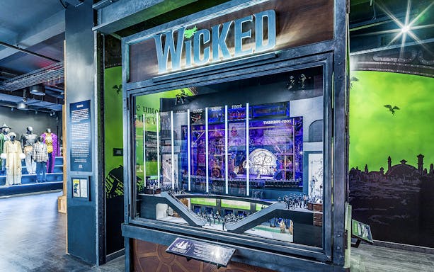 Wicked exhibit at the Museum of Broadway featuring costumes and stage model.