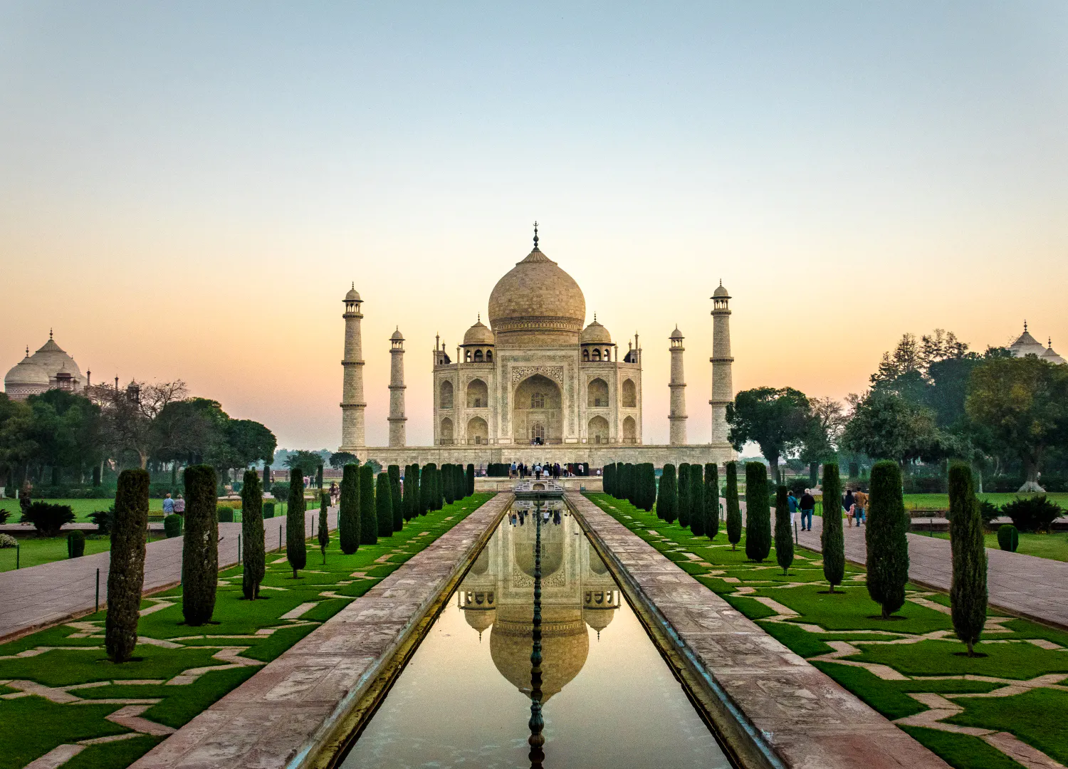 Sunrise view of the Taj Mahal with reflecting pool, Agra.