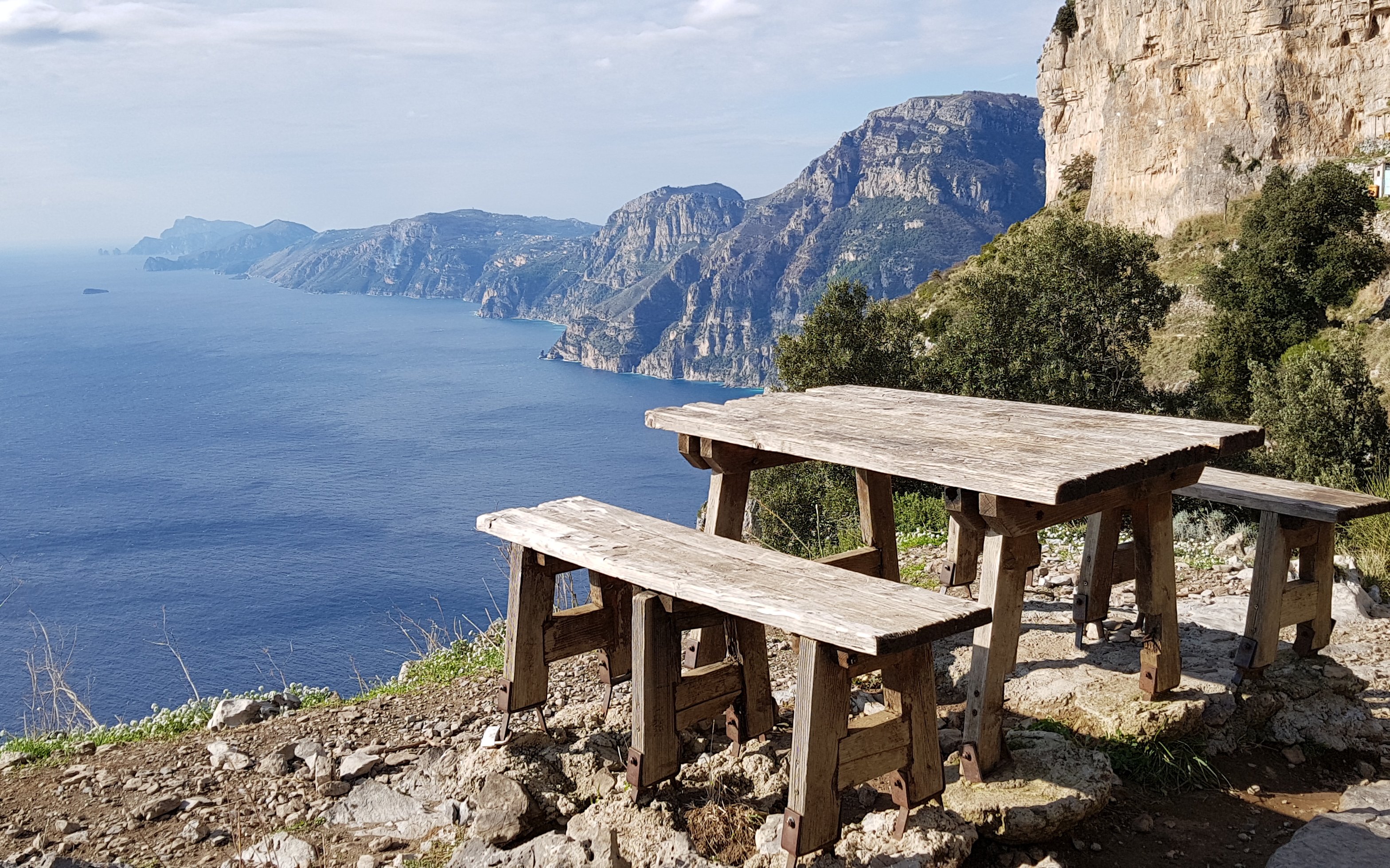 Scenic viewpoint with bench overlooking Amalfi Coast along Path of the Gods, Italy.