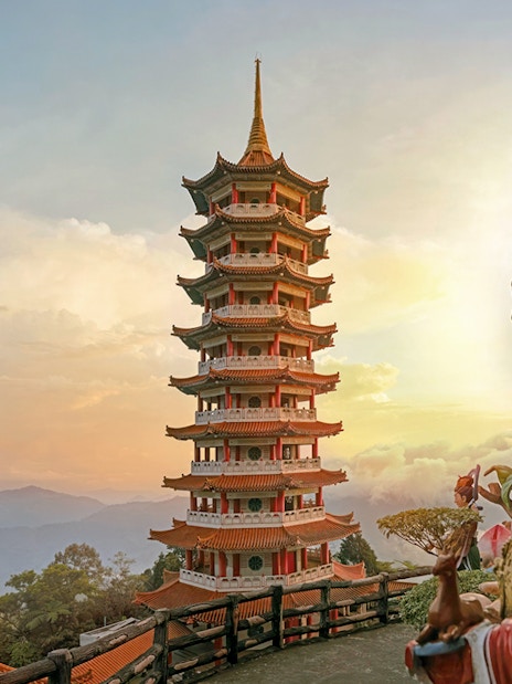 Genting Highlands pagoda and statue at sunset, Malaysia.