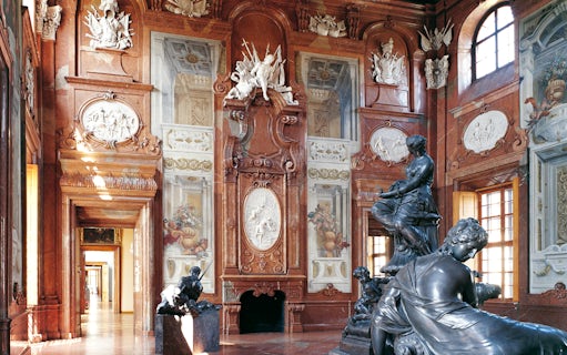 Hall of marbles with sculptures and ornate walls at Lower Belvedere Palace, Vienna.
