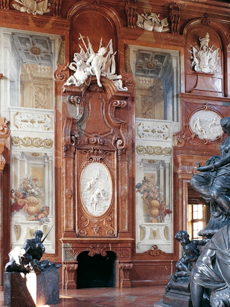 Hall of marbles with sculptures and ornate walls at Lower Belvedere Palace, Vienna.