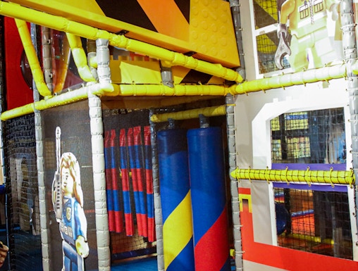 Indoor play area with LEGO-themed construction zone at LEGOLAND Discovery Center.