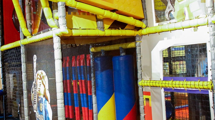 Indoor play area with LEGO-themed construction zone at LEGOLAND Discovery Center.