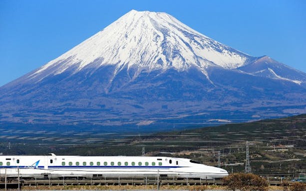 Bullet train passing in front of Mt Fuji, Japan.