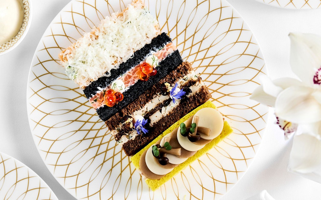 Pastries arranged on a decorative plate at Pearl Afternoon Tea, Platos.