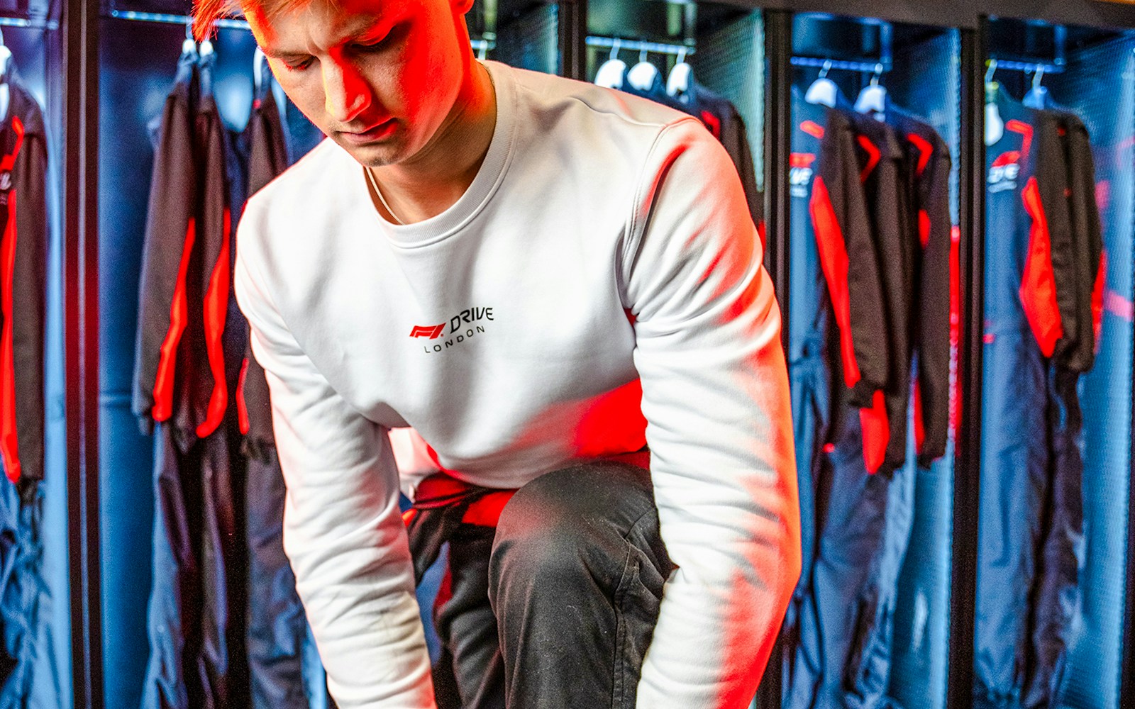 Guest in F1 Drive jacket preparing for go-kart session in London.