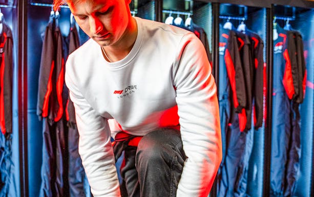 Guest in F1 Drive jacket preparing for go-kart session in London.
