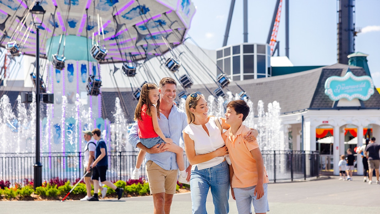 Dreamworld's Main Street with colorful buildings and visitors strolling, Gold Coast.