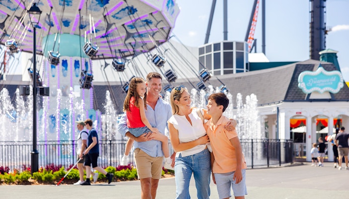Dreamworld's Main Street with colorful buildings and visitors strolling, Gold Coast.