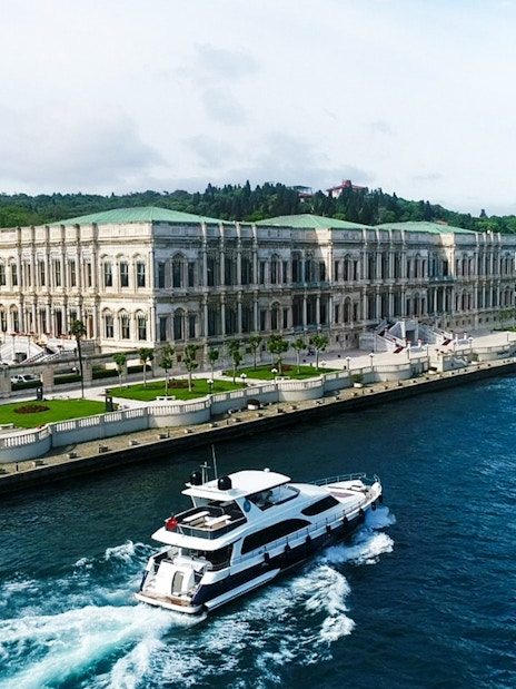 Bosphorus cruise boat passing by the Dolmabahçe Palace in Istanbul.