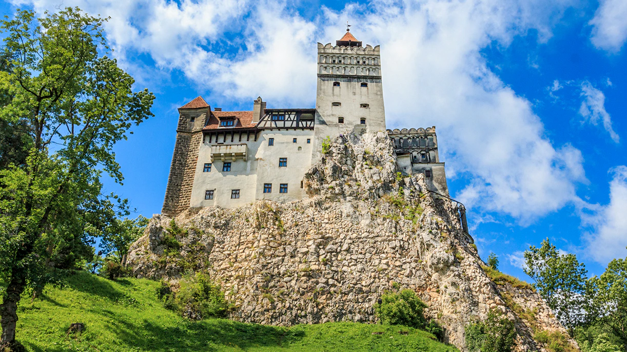 Bran Castle with medieval architecture on a rocky hill in Transylvania, Romania.