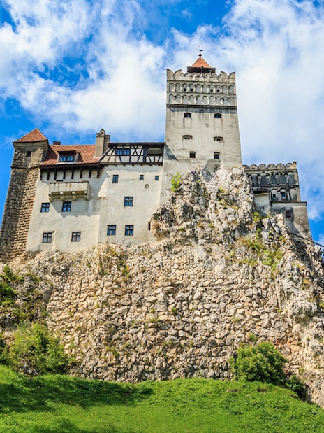 Bran Castle with medieval architecture on a rocky hill in Transylvania, Romania.