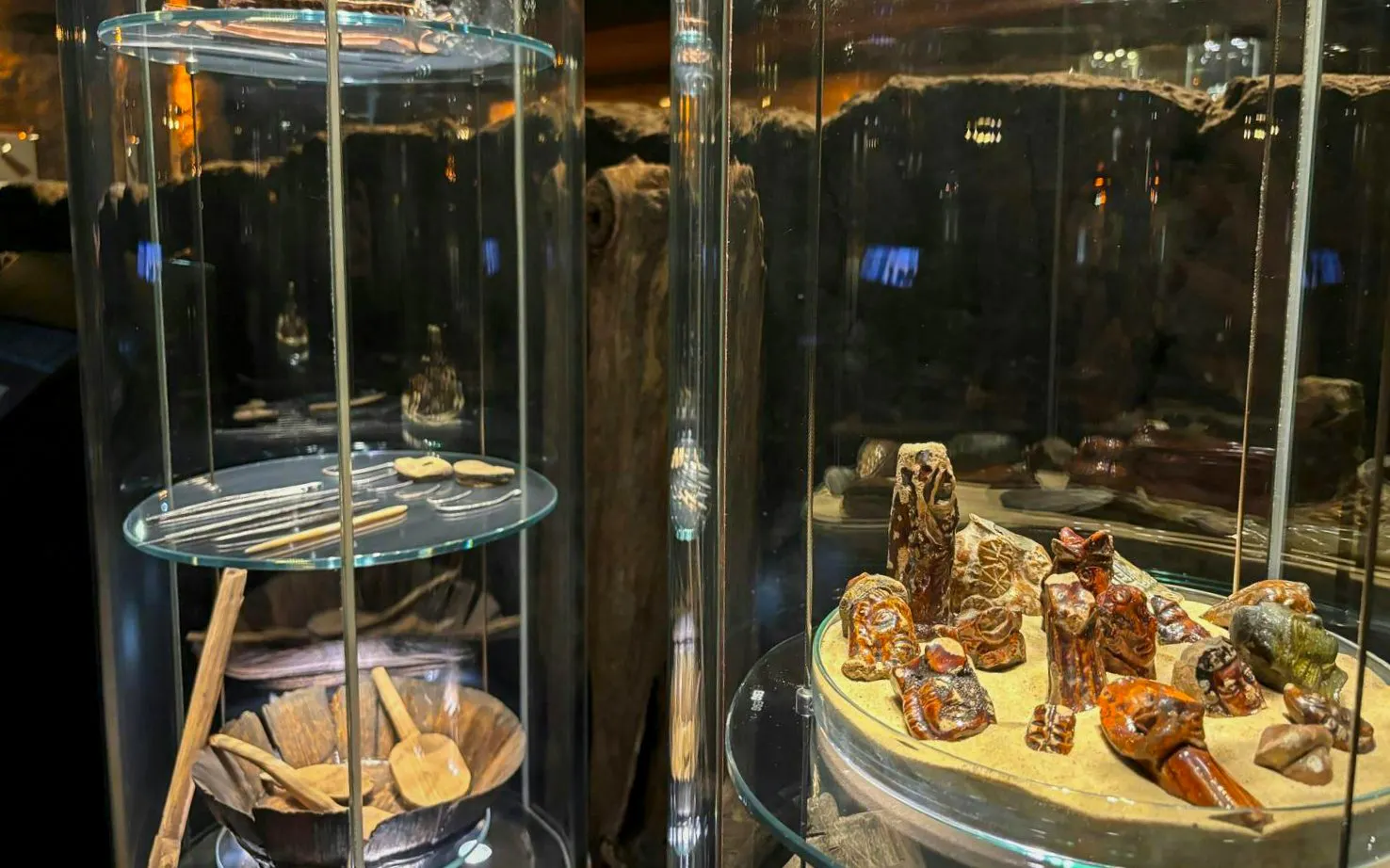 Artifacts displayed in glass cases at Rynek Underground Museum, Krakow.