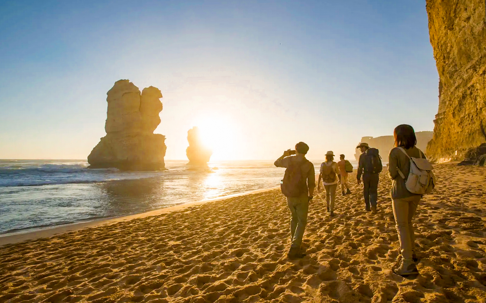 Great Ocean Road coastline with Twelve Apostles rock formations at sunset, Melbourne, Australia.