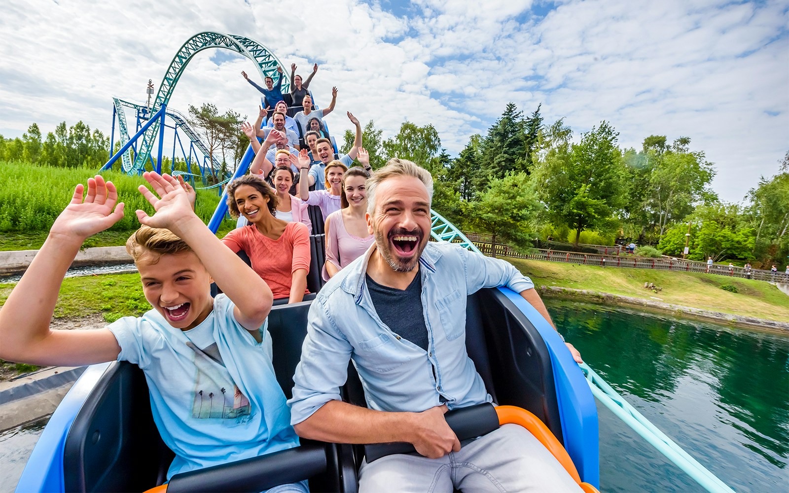 Visitors enjoying a roller coaster ride at Parc Asterix, France.