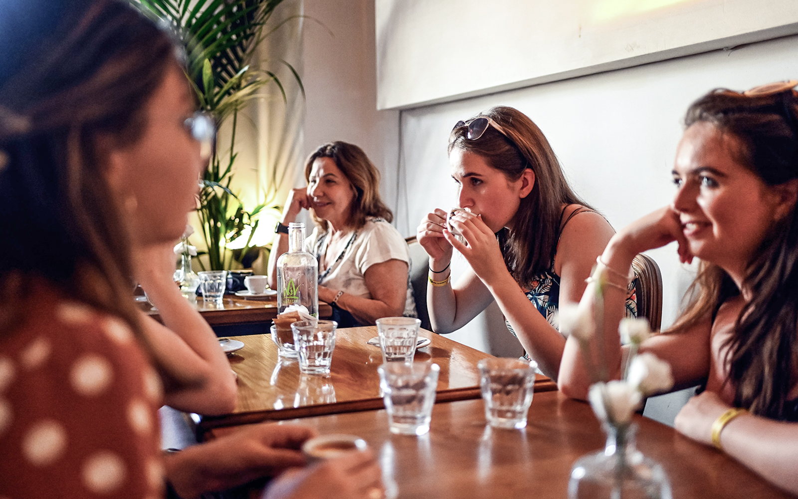 People enjoying a meal at a restaurant during a Rome food tour.