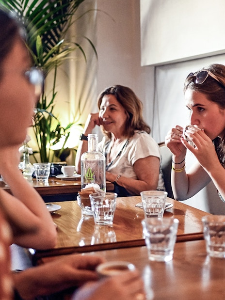 People enjoying a meal at a restaurant during a Rome food tour.